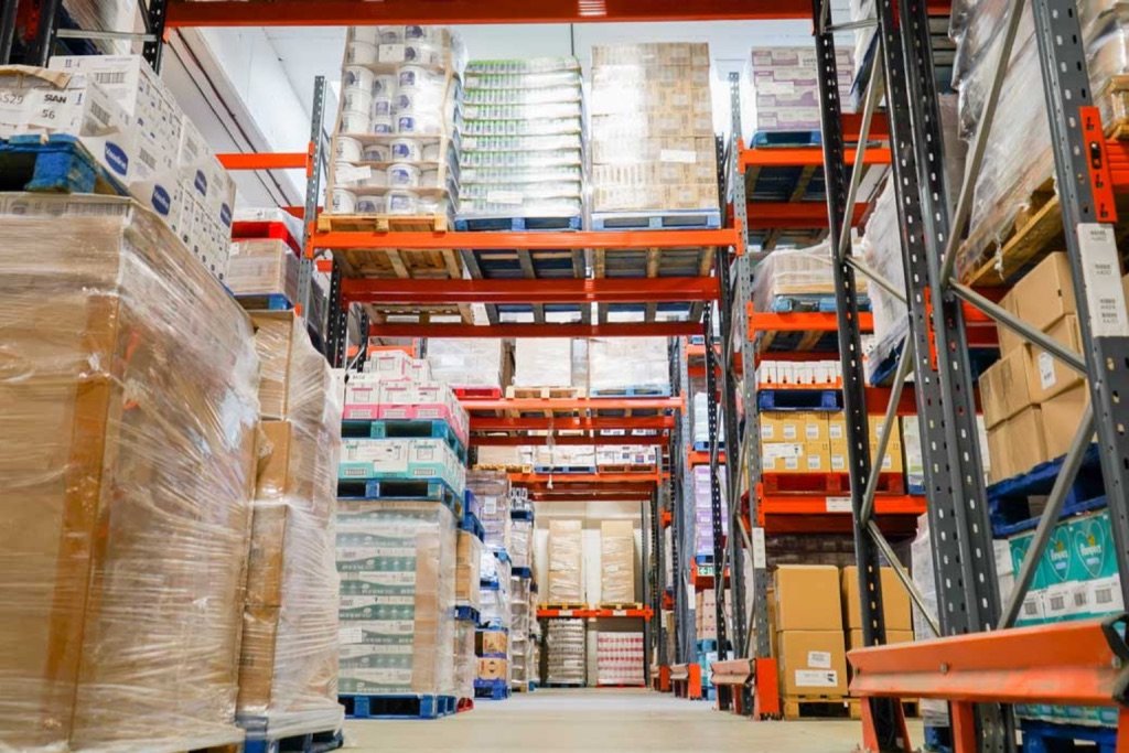 Warehouse racking with mixed pallets of branded FMCG products