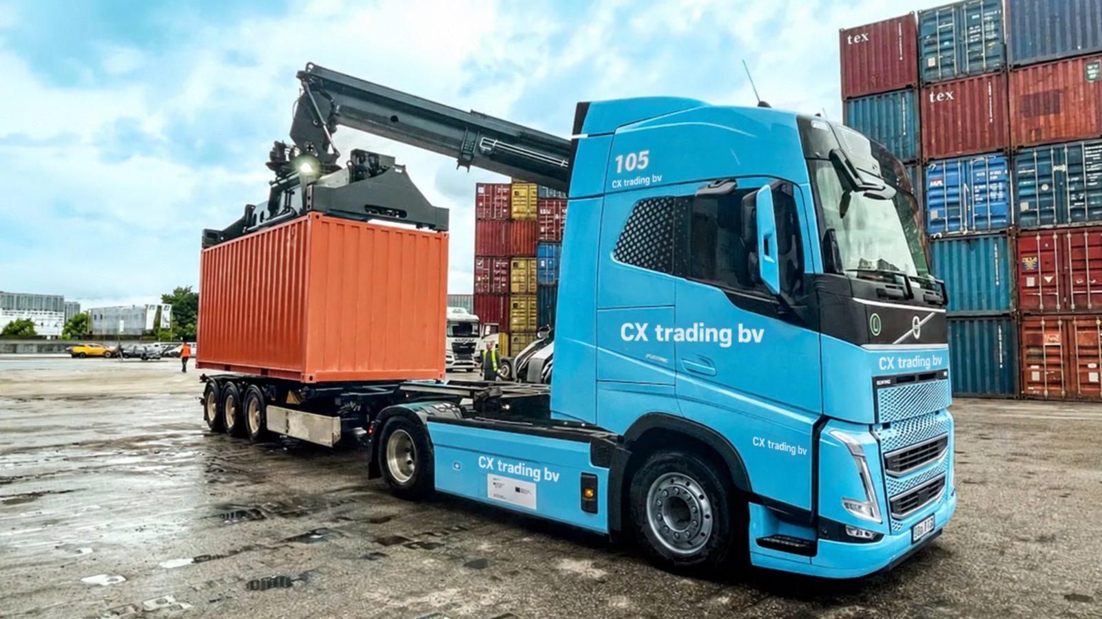 CX Trading truck being loaded with a shipping container at a port terminal
